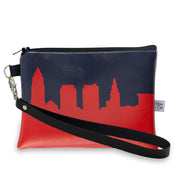 Clutch bag with city skyline design on a white background